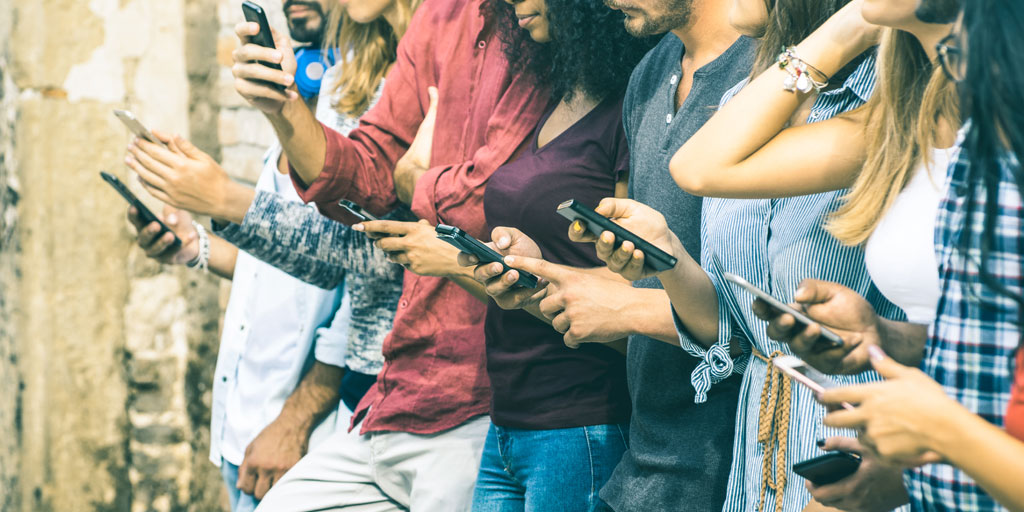 Teenagers using mobile phones